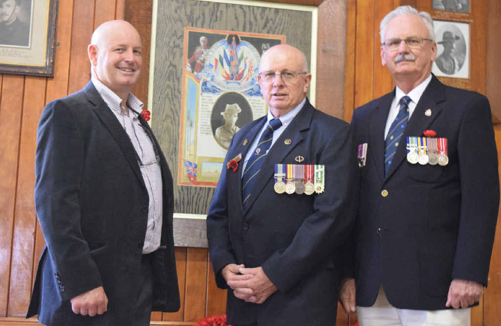 Freestone Hall committee president John Payne with Warwick RSL sub-branch president John Skinner and chaplain Reverend Kevin Stow.